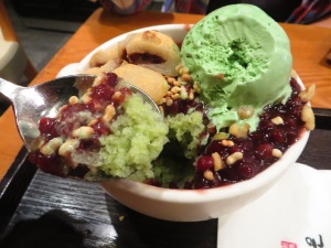 the ice was shaved frozen green tea. so legit. There's also sweet red bean, green tea ice cream, nuts, and ddeok. 